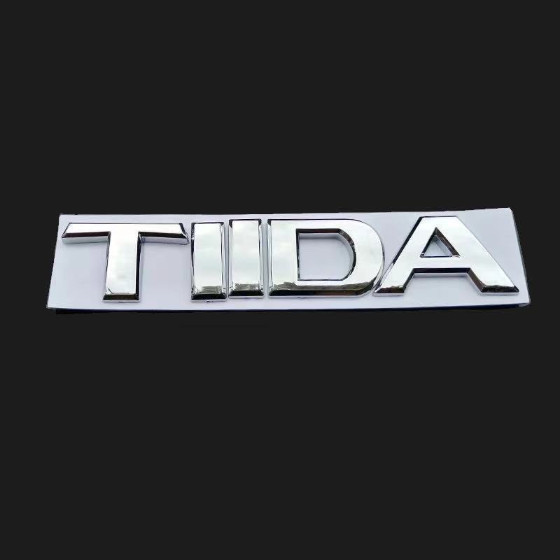 尼桑东风日产车标骐达标志tiida英文字母标志骐达后备尾箱标志tllda