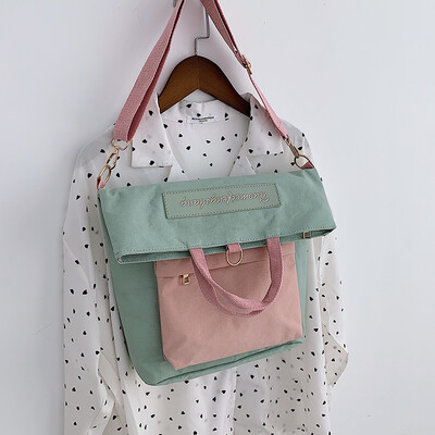 

New casual bag female 2019 new Korean version of the fashion contrast color canvas shoulders versatile shoulder slung tote bag