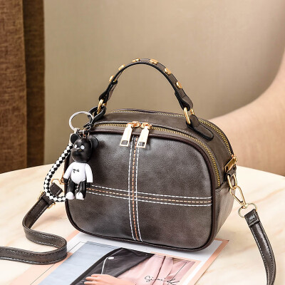 

The Korean version of Shangxin Womens Bag Chao Baitao oblique small round bag retro fashion ladys one-shoulder bag