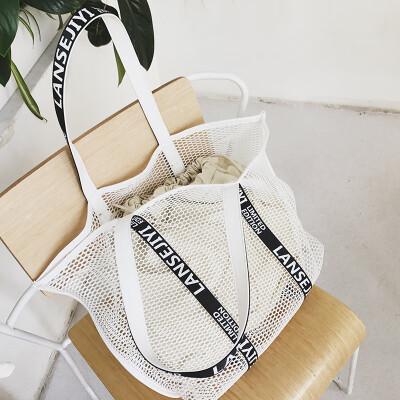 

On the new bag 2019 Korean version of spring&summer beach bag large capacity grid Tote hand bill of lading shoulder womens ba