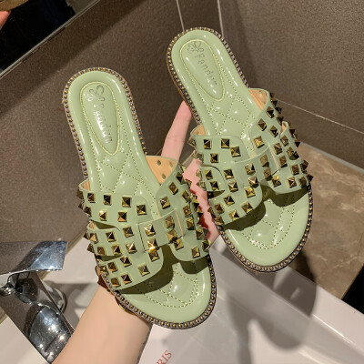 

Summer 2019 H slippers women wear ins tide net red rivets flat bottom wet water drag Joker beach shoes