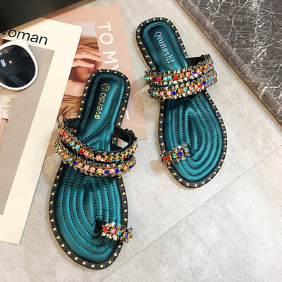 

Slippers for women wearing summer Korean version of Baitao fashion water drill sandwich clip toe flat-bottom beach shoes