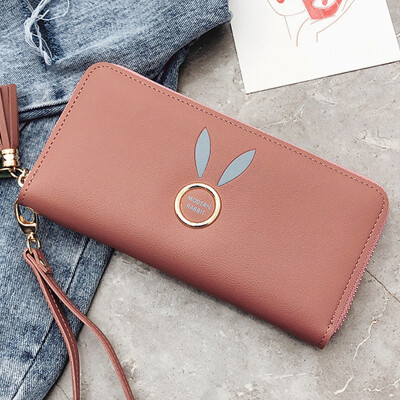 

Women holding wallets 2019 new Korean solid color zipper change clip wrist phone bag