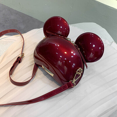 

Qiao Bani 2019 new South Korea Dongdaemun fashion lacquered Mickey splicing bag slant diagonal cross-flow PU handbag