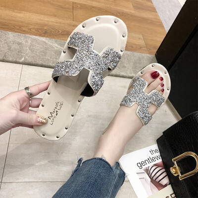 

Korean version of 2019 summer new fashion women wearing H slippers rhinestone net red flat bottom drag beach sandals women