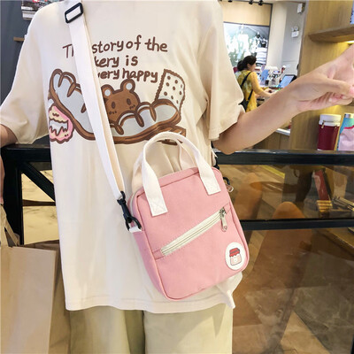 

On the new small bag canvas bag woman single shoulder bag oblique satchel college students hit the color of the ancient girl ins s