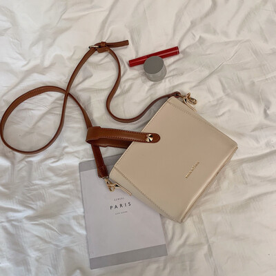 

Ins network celebrity texture simple handheld bucket bag woman 2019 new Korean version of early spring bag single shoulder oblique