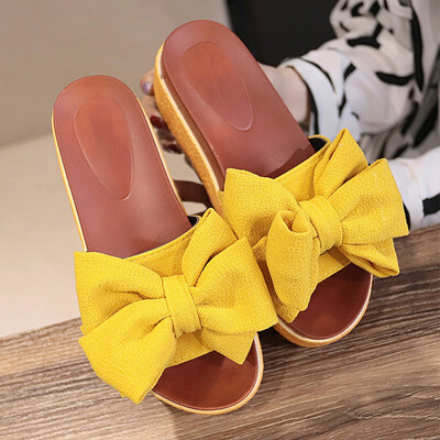 

Slipper female summer wearing a beach bow a word tow woman high-heeled beach shoes anti-slip thick sole cool drag