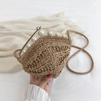 

Small bag female new fashion wild pearl dumplings wrapped hemp rope hollow woven shoulder Messenger bag