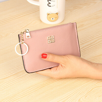 

The first layer of cowhide Europe&the United States big ladies leather short paragraph purse zipper mini lychee with ring key bag