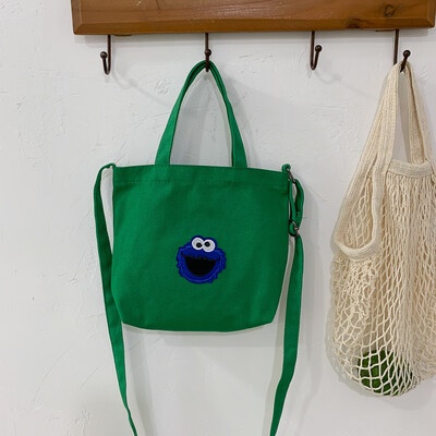 

Casual fashion ugly sesame street portable canvas bag female 2019 new cute cartoon wild shoulder Messenger bag