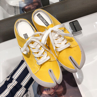 

Canvas slippers for women wearing summer Korean version of Baitao lace-up half-dragged split-toed leopard-print flat-soled Muller