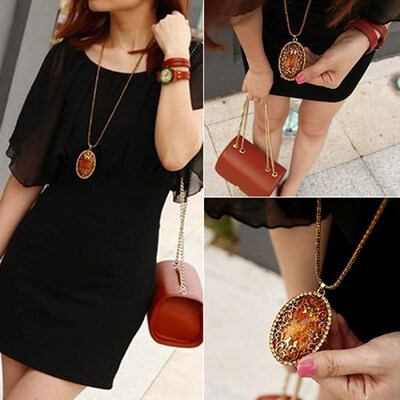 

Womens Vintage Amber Tone Hollow Long Chain Drop Pendant Sweater Necklace