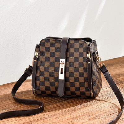 

Summer ladies go on the fashion trend with simple bucket bag on one shoulder in summer