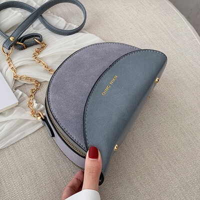 

One shoulder slanted small bag double zipper 2019 Korean version of the new fashion semicircular bag hit color chain small bag tid