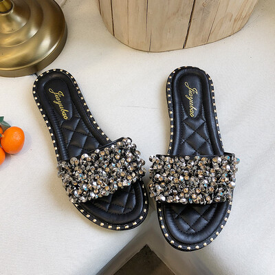 

Hong Kong wind slippers womens summer fashion outside wearing flat-bottomed sequins a word drag holiday beach shoes
