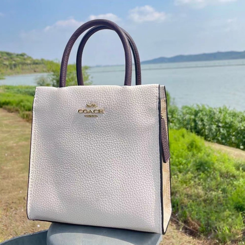 coach蔻驰女包cally17皮革琴谱包手提单肩斜挎包迷你托特包女包米色