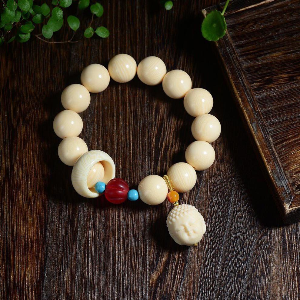 游走岁月猛犸象牙圆珠手串搭配雕刻如来等高端典雅大气品味的体现 小