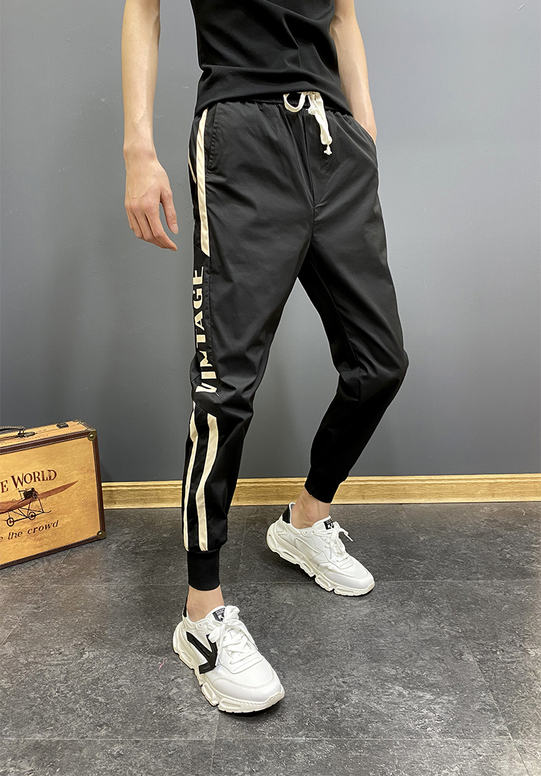 精神小伙裤子夏秋季网红帅气小伙九分哈伦束脚裤修身双杠大码休闲