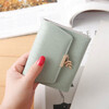 Woodpecker (TUCANO) 2026 new wallet Japanese and Korean version embossed women's short buckle wallet small fresh leaf pendant student small card holder green