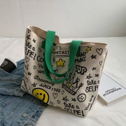 Yang Xueqiu borsa di tela borse di vendita femminile borsa di grande capacità 2022 nuovo stampato smiley bag ins stile borsa della spesa a mano tote bag femminile Disney verde