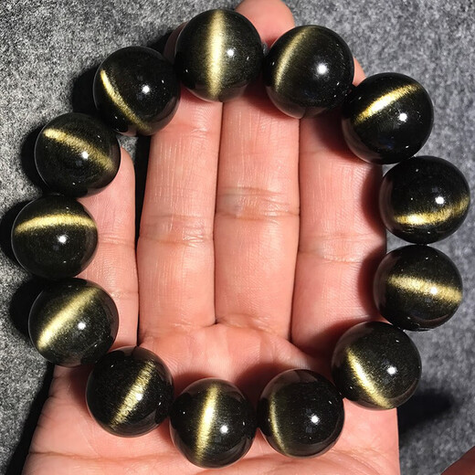 
Natural gold obsidian bracelet curved double cat eyes obsidian men and women cat eyes stone shining stone number 2070 bead diameter 20 mm