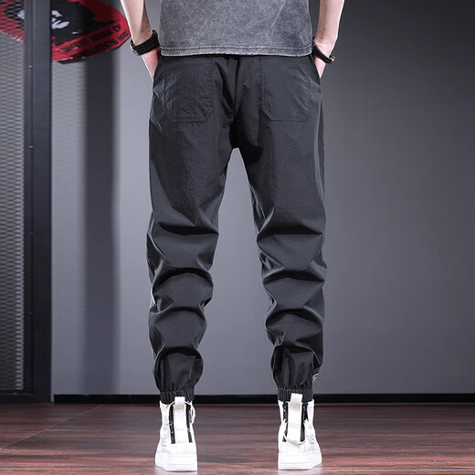 Pantalon décontracté de New Balance pour hommes minces fine marque de design de design harem pantalon harilé pantalon de sport à séchage rapide pantalon britannique