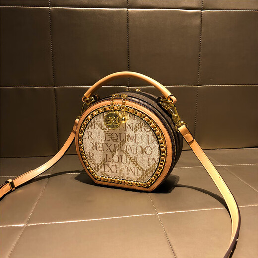 Sac à carres de vache de marque Hong Kong Sac pour femmes Sac de cylindre rétro Sac à épaule lettre de mode sac à corps crossbody sac petit sac