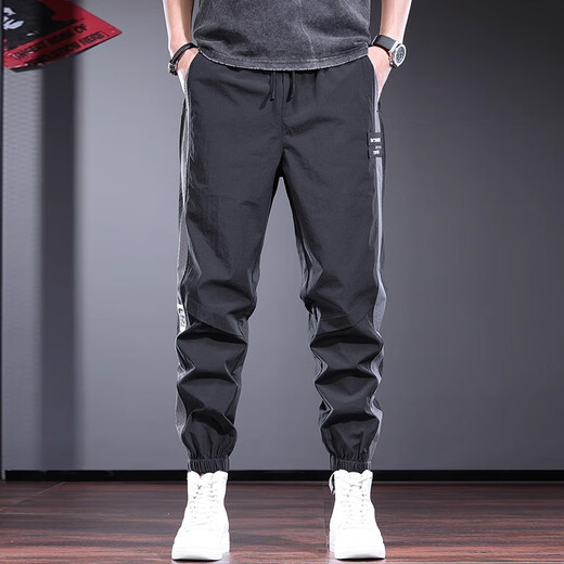 Pantalon décontracté de New Balance pour hommes minces fine marque de design de design harem pantalon harilé pantalon de sport à séchage rapide pantalon britannique