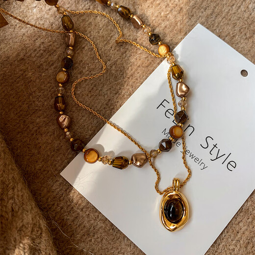 YIZUN. CHOMEL Maillard wear tiger eye stone beaded necklace women's autumn and winter 2024 new light luxury niche versatile sweater chain suit