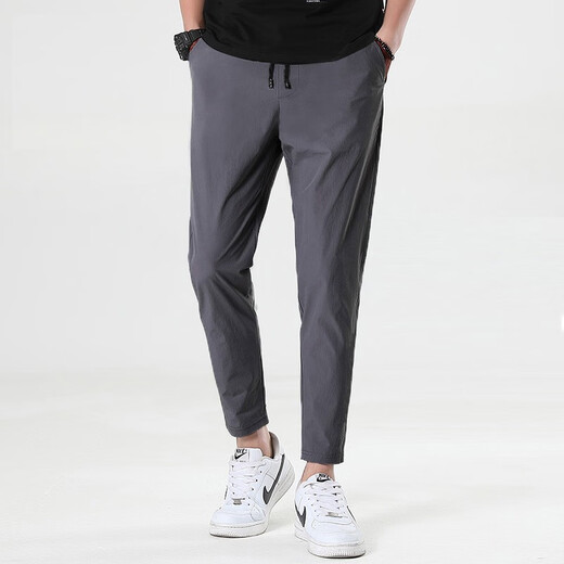 Dumeizi Pantalones casuales para hombres en verano Lace-up suelto delgado y versátil delgado y delgado Slim pies pequeños Harun nueve puntos Negro de moda