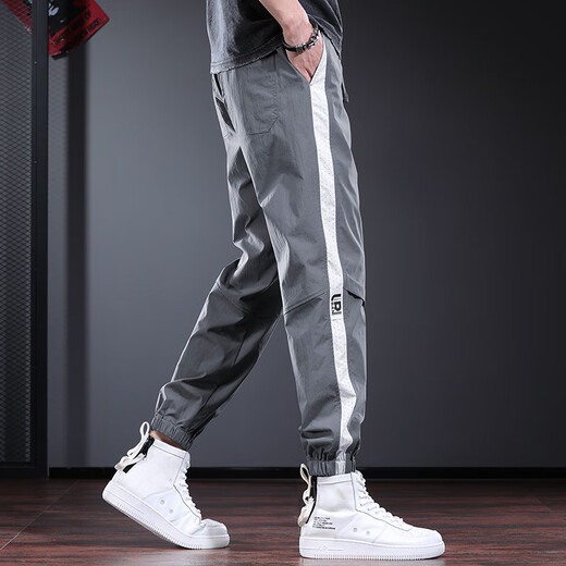 Pantalon décontracté de New Balance pour hommes minces fine marque de design de design harem pantalon harilé pantalon de sport à séchage rapide pantalon britannique