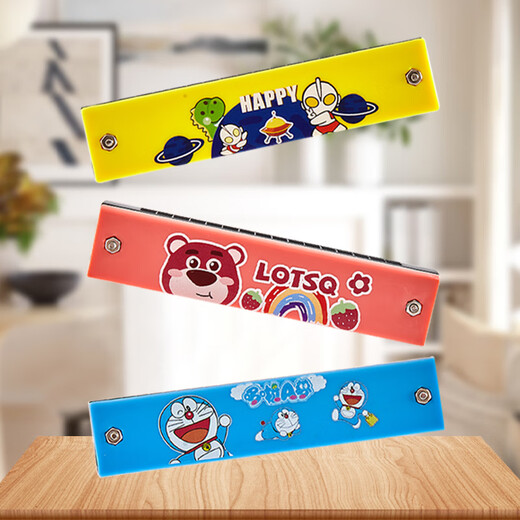 FUERBAO Double rang Harmonica For Children pour les enfants débutants à 16 trous Organe de maternelle Écolier primaire Utilisez des instruments de sifflet de minimum de dessins animés pour envoyer des sacs en tissu et des scores de piano