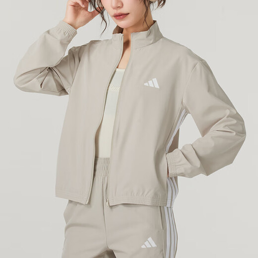 Adidas Jacke für Frauen 2025 Herbst Outdoor Fitness Training Mode gewebte Standkragen Jacke Freizeit komfortable Sportbekleidung JE6173/Light Khaki M.