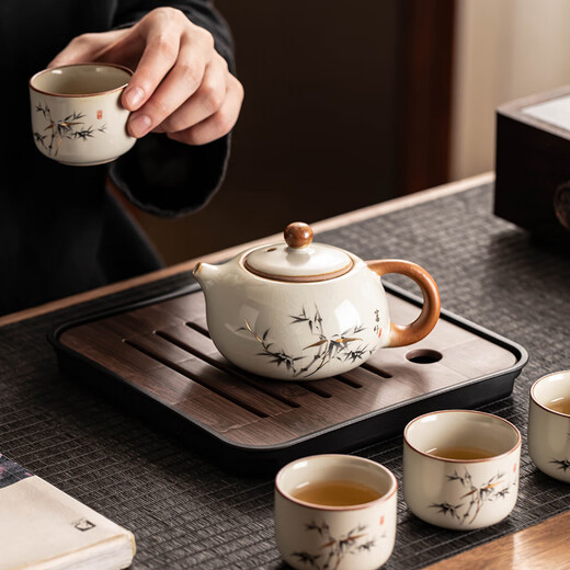 Porcelain brand tea set, one pot and four cups, household light luxury Kung Fu teapot, tea cup with tea tray, small set for making tea for guests, Huang Ru Yu Huang Liang 4 cups + walnut color small square plate