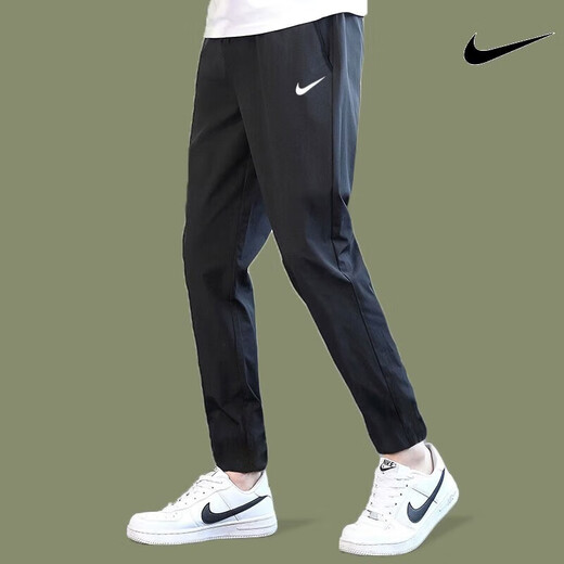 Nike (Nike) pantalones para hombres Summer Nuevos pantalones deportivos al aire libre Pantalones casuales de hombres transpirables delgados pantalones sueltos Pantalones rectos DM6627-010 Secado rápido de secado L