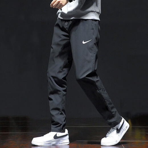 Nike (Nike) pantalones para hombres Summer Nuevos pantalones deportivos al aire libre Pantalones casuales de hombres transpirables delgados pantalones sueltos Pantalones rectos DM6627-010 Secado rápido de secado L