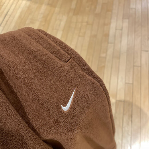 Nike (Nike) Pantalones oficiales Pantalones para mujeres Otoño e invierno Nuevos pantalones deportivos al aire libre más al tercio