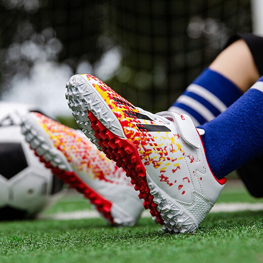 Chaussures de football tangcun pour enfants tf ongles brisés velcro pour garçons et filles élèves de l'école primaire professionnels formation de taille pour enfants de taille spéciale 6199 blanc et rouge brandissant 33 chaussures de sport standard taille