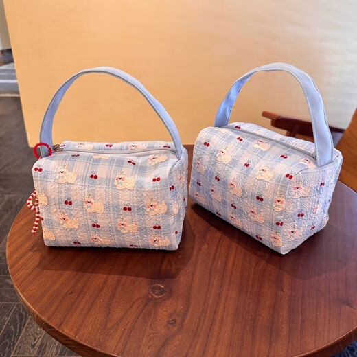 2025 new high-value makeup storage bag large capacity portable washing and storage three-dimensional travel makeup handbag blue pleated puppy handbag