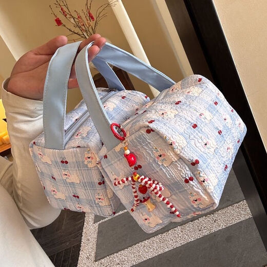2025 new high-value makeup storage bag large capacity portable washing and storage three-dimensional travel makeup handbag blue pleated puppy handbag