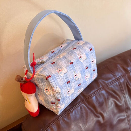 2025 new high-value makeup storage bag large capacity portable washing and storage three-dimensional travel makeup handbag blue pleated puppy handbag
