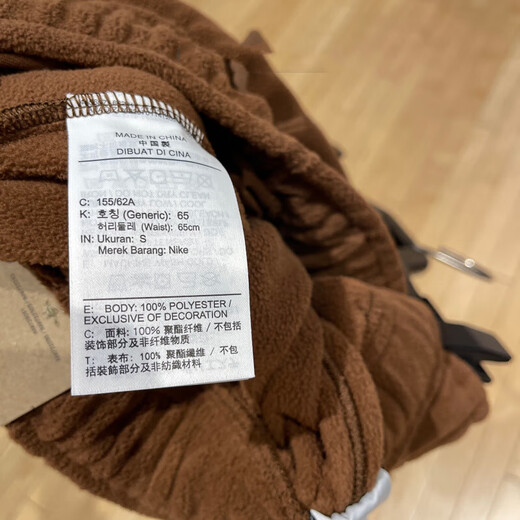 Nike (Nike) Pantalones oficiales Pantalones para mujeres Otoño e invierno Nuevos pantalones deportivos al aire libre más al tercio