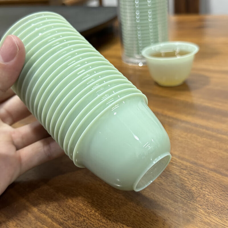 Disposable tea cup 60ML jade imitation jade high-end small Chinese tea cup thickened anti-scalding travel portable jade cup 100 pieces + cup holder