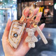 Xinhe (Xinhe) Adecuado para la cubierta de llave BMW 530 Shell 12357 Serie 325li525 Mujeres X1X2X3X4X5X6 Hebilla de la cuchilla de la bolsa A estilo] Cristal White + Gold Star Diamond Bear + White Bear