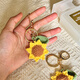 Seven Moons <Snatch Sunflower en una huelga> Regalo de la temporada de graduación de la cadena de girasol de hilo tejido a las bendiciones del examen de los estudiantes