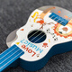 Lige Calidad alemana Ukulele Juguetes de guitarra para niños Pequeño instrumento de guitarra Música Educación temprana Regalos de cumpleaños de bebés Cigarrillo Polvo Superman Pig Girl