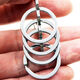 Llavero de acero inoxidable de runhuaniano engrosados ​​de pies pequeños creativos y de moda para hombres y mujeres de múltiples anillos de múltiples anillos para el hogar anillos de llave del hogar, combinación de pies pequeños y pequeños (acero inoxidable)