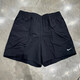 Nike (Nike) Pantalones de chándal Pantallas de mujer 2025 Summer Nuevo pantalones casuales Tendencia de moda tejida entrenamiento transpirable pantalones cortos cómodos FV6623-010 Negro 2xl