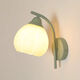 Opu Yuanxing simple bedroom wall light led green bedside lamp cream windshield iron art living room balcony staircase decorative wall light B686 green lily of the valley flower 5 watts warm light